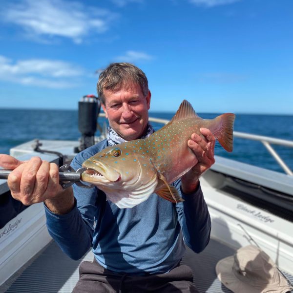 a man holding a glass of water