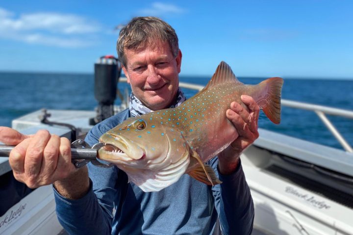 a man holding a glass of water