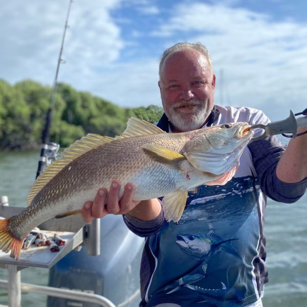 a man holding a fish